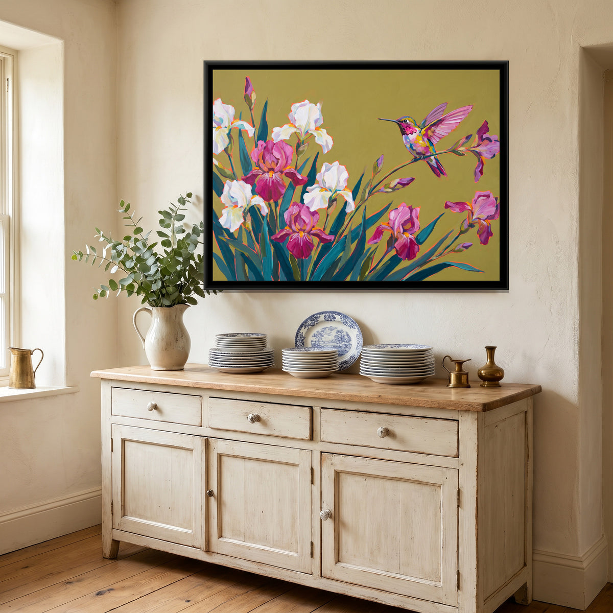 Perched Hummingbird and Irises - canvas art shown in a styled room