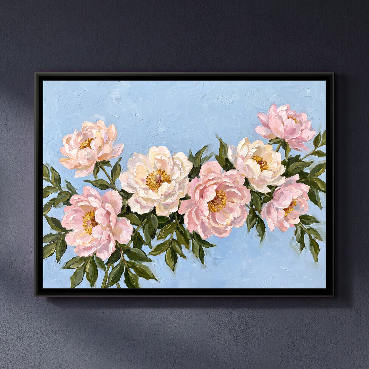Blush Blooms on Blue - framed canvas art hung on a wall